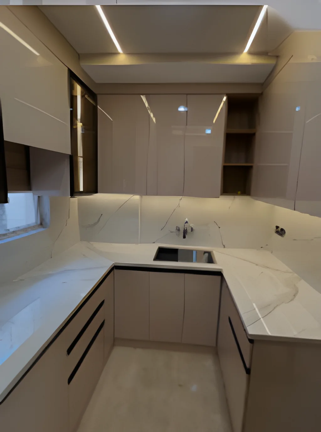 U-shaped modular kitchen in warm taupe with stone counters and recessed cove lighting